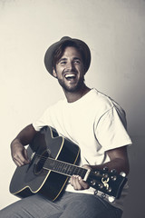 Happy doctor playing the guitar