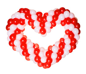Heart shape made from red and white balloons