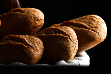 Bread basket on black background