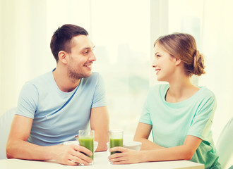 Fototapeta premium smiling couple having breakfast at home