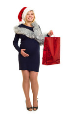 pregnant woman in santa hat shopping