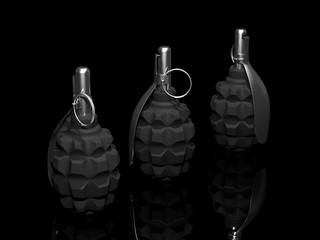 Three fragmentation grenades in a row on a dark mirror surface