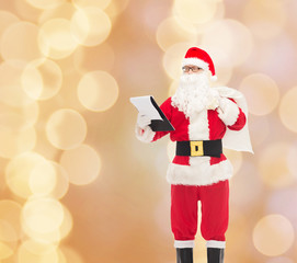 man in costume of santa claus with notepad and bag