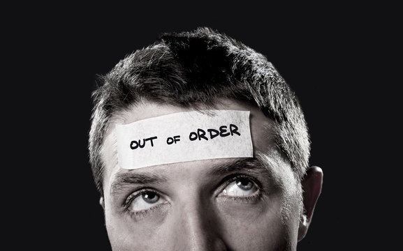 young man forehead tape text out of order in empty mind concept