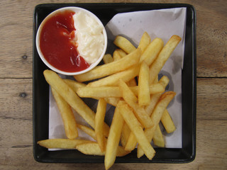 french fries with ketchup and mayonnaise sauce