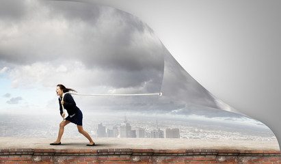 Woman pulling banner