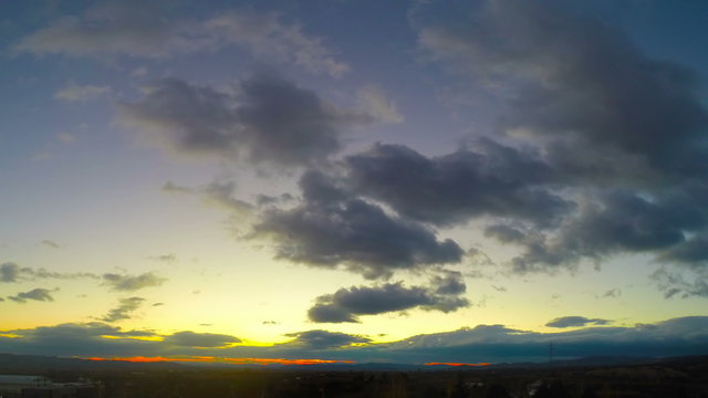 Timelapse of a sunset above the hills