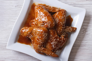 chicken wings with sesame seeds closeup top view horizontal