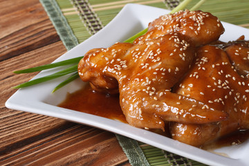 Chicken glazed with sesame seeds close-up horizontal