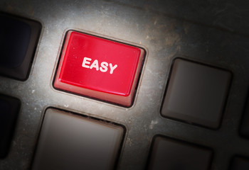 Red button on a dirty old panel