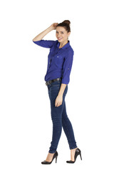 Portrait of a beautiful woman in blue jeans and blue shirt
