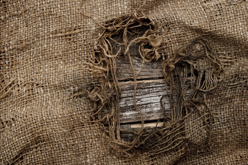 background of burlap with a hole for writing text. texture of th
