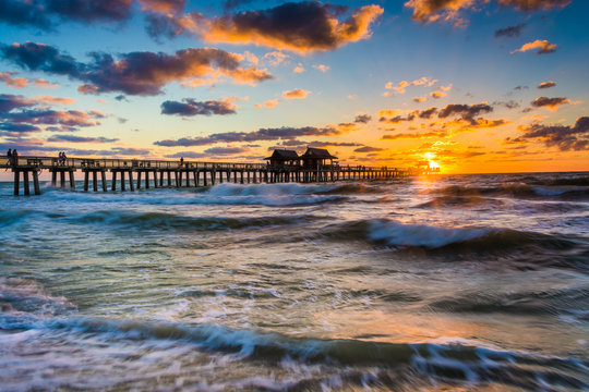 Sunset Over The Fishing Pier And Gulf Of Mexico In Naples, Flori