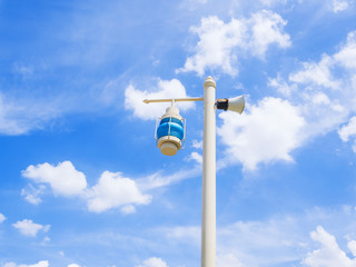 electric street lamp on blue sky