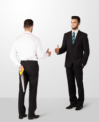 Two businessman shake hands