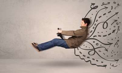 Funny man driving a flying vehicle with hand drawn lines after h