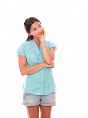 Fototapeta premium Young woman holding chin and looking up