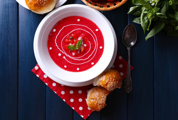 Gazpacho soup on color wooden background