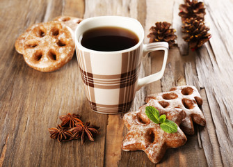 Cup of tea with cookies on table close-up