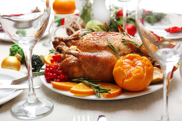 Baked chicken for festive dinner. Christmas table setting