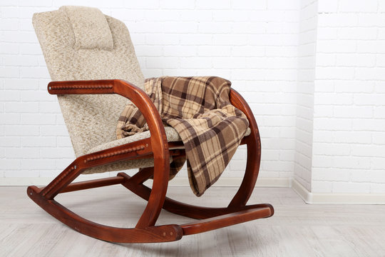 Rocking chair covered with plaid