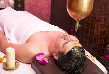 man engaged in Ayurvedic spa treatment