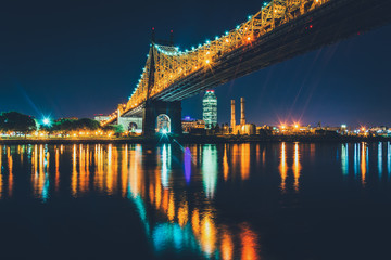Fototapeta na wymiar The Queensboro Bridge at night, seen from Roosevelt Island, New