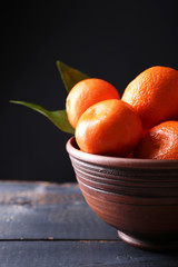 Fresh ripe mandarins in bowl,