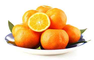 Tasty mandarins on plate isolated on white