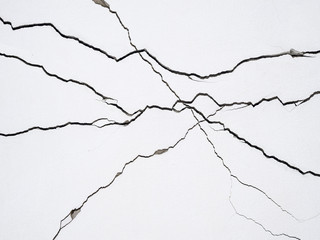 cracks on concrete wall creating lines