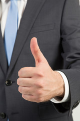 businessman giving  thumbs up