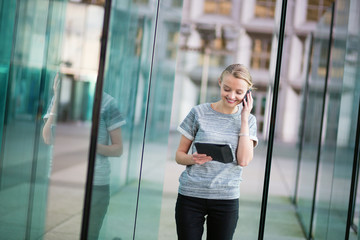 Young business woman speaking on the phone