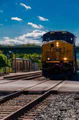 A CSX train approaching a road crossing in Brunswick, Maryland.