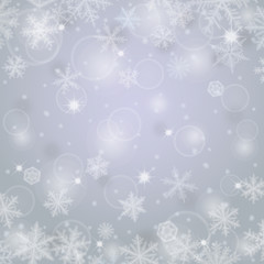 Fototapeta na wymiar Abstract ligh christmas background with snowflakes.