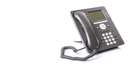 Modern desktop telephone over white background 