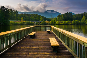Benches on a small pier and view of Table Rock at Lake Oolenoy,