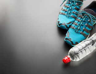 Sports runners and a bottle of water