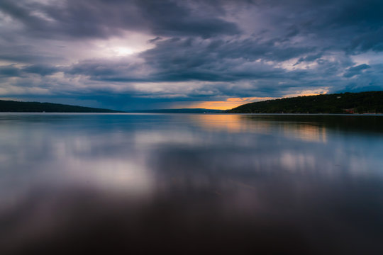Storm clouds move over Lake Cayuga in a long exposure, seen from