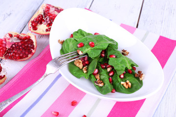 Fresh salad with greens, garnet and spices