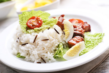 Boiled rice served on table, close-up