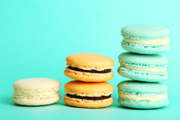 Gentle colorful macaroons on color background