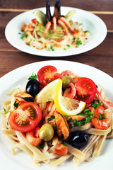 Assortment of Tasty pasta with shrimps, mussels, black olives