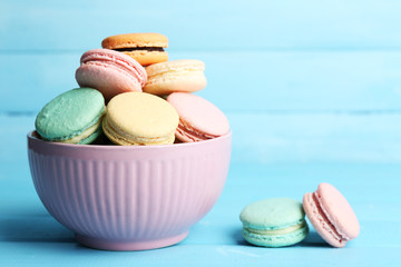 Assortment of gentle colorful macaroons in colorful bowl