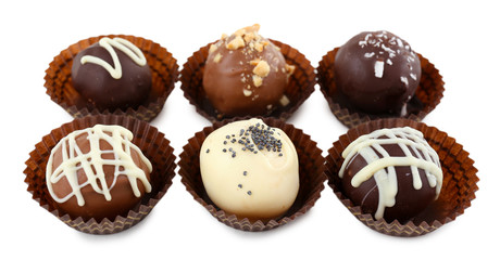 Delicious chocolate candies isolated on white
