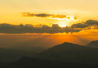 Beautiful sun ray stab from cloud and mountain