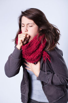 Coughing girl in scarf
