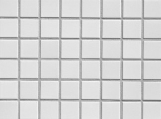 White mosaic tile wall seamless background and texture