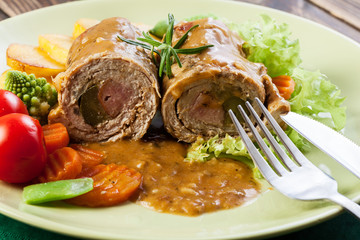 Pork rolls with prepared potatoes and vegetables