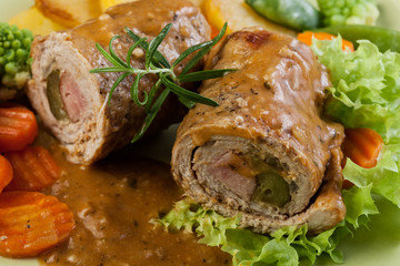 Pork rolls with prepared potatoes and vegetables