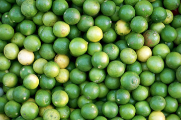 Fresh and green lemon at the market for background